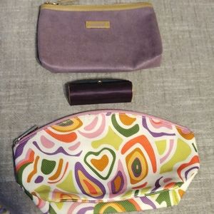 2 makeup bags and a lipstick holder.